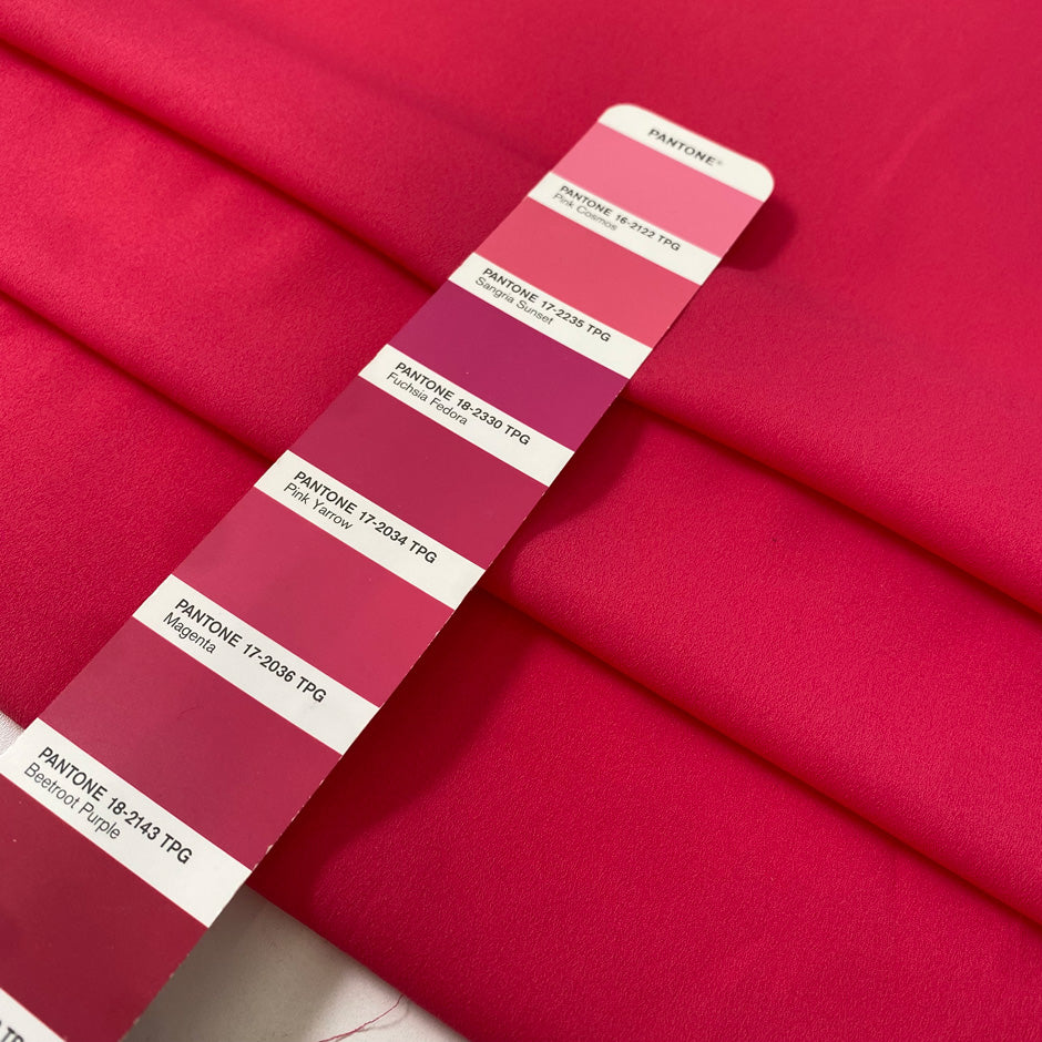 Fluorescent fuchsia polyester crêpe de chine with a fluid drape and matte texture ideal for bold blouses dresses and linings. High-quality deadstock collected in Stock from a Maison de Couture in Italy.