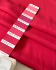 Silk and acetate crepe de chine in fuchsia color, reference Innuendo. Very soft, light and flowy, not transparent. Ideal for shirting, blouses, dresses, and skirts. High-quality deadstock collected in Stock from a Maison de Couture in Italy.
