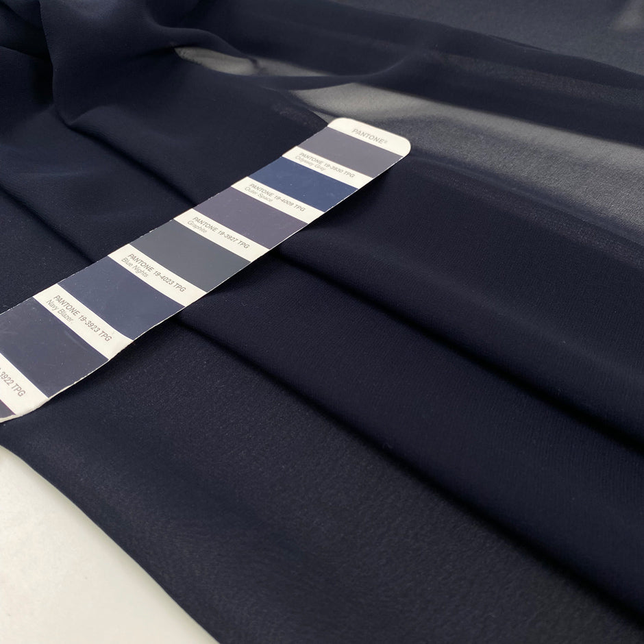 Pure silk chiffon in dark blue. Very light and soft. High-quality deadstock fabric collected in Stock from a Maison de Couture in Italy.