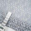 Gray cotton and polyester rebrodè lace fabric. It is falling and transparent. High-quality deadstock fabric collected in Stock from a Maison de Couture in Italy. Gray cotton and polyester rebrodè lace fabric. It is falling and transparent. High-quality deadstock fabric collected in Stock from a Maison de Couture in Italy.