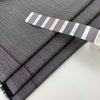 Gray and white stretch wool pinstripes. High quality deadstock fabric. Gray and white stretch wool pinstripes. High quality deadstock fabric.