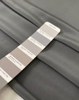 Pure silk crepe de chine in goth gray. Very soft and light, flowy, and not transparent. Ideal for shirting, blouses, dresses, and skirts. High-quality deadstock collected in Stock from a Maison de Couture in Italy.