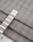 Prince of Wales of pure virgin wool stripes in grey color. High quality deadstock fabric collected in Stock from a Maison de Couture in Italy.
