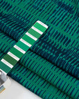 Cady polyester patterned green and blue. High quality deadstock fabric.