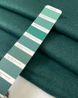 Heavy wool and polyester mix in dark green, shade Posy green. Very soft and warm, ideal for jackets and coats. High-quality deadstock collected in Stock from a Maison de Couture in Italy.