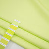 Textured fabric of pure bright green cotton. High-quality deadstock fabric collected in Stock from a Maison de Couture in Italy. Textured fabric of pure bright green cotton. High-quality deadstock fabric collected in Stock from a Maison de Couture in Italy.