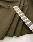 Pure green wool gabardine, structured and heavy. High-quality deadstock fabric collected in Stock from a Maison de Couture in Italy.