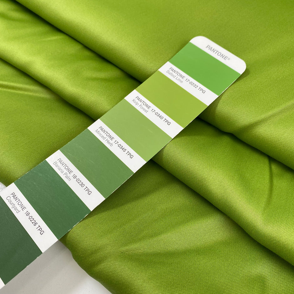Pure viscose cady, very heavy and stiff in bright olive green with shiny sides. High-quality deadstock fabric by the meter collected in Stock from a Maison de Couture in Italy.