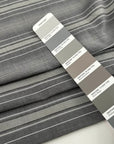 Gray striped cotton jacquard with an irregular pattern, soft and non-stretch. High-quality deadstock collected in Stock from a Maison de Couture in Italy.