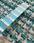 Soft cotton and lurex tweed with an ivory base and turquoise lurex accents in a pied de poule texture. Ideal for jackets, light coats, skirts, and dresses.High-quality deadstock collected in Stock from a Maison de Couture in Italy.