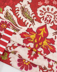 Red-based and printed linen and cotton. The fabric has a floral and structured design. High-quality deadstock fabric collected in Stock from a Maison de Couture in Italy.