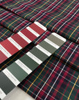 Pure cotton poplin with tartan design in the shades of dark green, red and yellow. Crunchy, flowy and not transparent. Ideal for shirts, dresses and skirts. High-quality deadstock collected in Stock from a Maison de Couture in Italy.