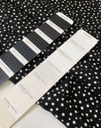 Pure silk crêpe de chine, very soft and light, with a black and white polka dot print. Not transparent and very flowy. Ideal for shirting, dresses, and skirts. High-quality deadstock collected in Stock from a Maison de Couture in Italy.