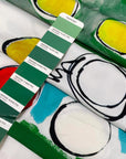 Light and soft polyester twill with a white base and large multicolor print in shades of red, yellow, black, green, and light blue. Ideal for dresses, skirts, blouses, and shirting. High-quality deadstock collected in Stock from a Maison de Couture in Italy.