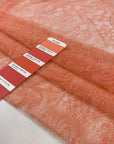 Very soft and light lace in peach color, polyester with beautiful floral design. High-quality deadstock fabric collected in Stock from a Maison de Couture in Italy.
