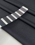 Double-face polyester and elastane fabric with dark grey front and light grey back, very soft and medium weight, ideal for reversible garments, jackets, and dresses. High-quality deadstock collected in Stock from a Maison de Couture in Italy.