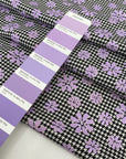 Mixed polyester and wool with pied de poule in black and white and flower design in lilac. Very soft and light, warm. Ideal for dresses, trousers, skirts and jackets.High-quality deadstock collected in Stock from a Maison de Couture in Italy.