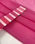 Very light micro tulle and stretchy in fuchsia. Light and transparent, with a very soft and flowy texture. High-quality deadstock fabric by the meter collected in Stock from a Maison de Couture in Italy.