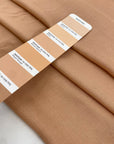 Pure viscose very soft and flowy in almost apricot pink. Ideal for shirts, skirts, dresses, and blouses. High-quality deadstock fabric by the meter collected in Stock from a Maison de Couture in Italy.