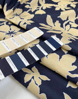 Printed polyester cinzato with floral design in dark blue, ecru, and yellow, very crunchy and not transparent, ideal for structured garments and bold pieces. High-quality deadstock collected in Stock from a Maison de Couture in Italy.