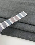 Light gray polyester seersucker with a crisp, puckered texture. Perfect for airy, wrinkle-resistant garments. High-quality deadstock collected in Stock from a Maison de Couture in Italy.