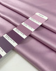 Lilac matte polyester satin with a soft hand and elegant drape, perfect for dresses, linings, and fluid pieces. High-quality deadstock collected in Stock from a Maison de Couture in Italy.