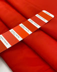 Crepe de chine in acetate and silk, very soft and light, in lobster orange. High-quality deadstock fabric by the meter collected in Stock from a Maison de Couture in Italy.