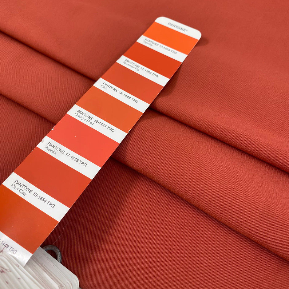 Stretch viscose, polyester, and polyamide comfort in rust color, color reference paprika. Very soft, stretch, and light. Ideal for trousers, dresses, and skirts. High-quality deadstock collected in Stock from a Maison de Couture in Italy.