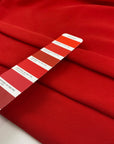 Red heavy cotton jersey with a textured surface, slight stretch, and soft, flowy drape. High-quality deadstock collected in Stock from a Maison de Couture in Italy.