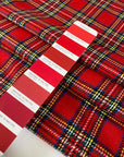 Tartan fabric in a soft wool and polyester blend with a classic Scottish design in shades of red, blue, white, and green. Very soft and warm, ideal for dresses, skirts, and light jackets. High-quality deadstock collected in Stock from a Maison de Couture in Italy.