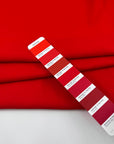 Red viscose-acetate crepe cady, soft, fluid and non-stretch. Perfect for trousers. High-quality deadstock collected in Stock from a Maison de Couture in Italy.