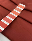 Pure viscose, very soft, light, and flowy in cinnabar dark red. Ideal for skirts, blouses, shirts, and dresses. High-quality deadstock fabric by the meter collected in Stock from a Maison de Couture in Italy.