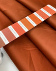 Double-face waterproof fabric in wool, polyamide, silk and elastane. In cinnamon stick on one side and sand on the reverse. Ideal for outerwear. High-quality deadstock collected in Stock from a Maison de Couture in Italy.
