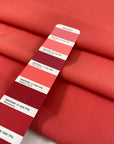 Polyester cady in calypso coral, very soft, flowy and with a matte finish. Ideal for trousers, skirts, dresses and jackets. High-quality deadstock collected in Stock from a Maison de Couture in Italy.