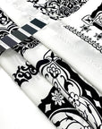 Pure silk satin printed with a panel design in black and white. Very soft and light. High-quality deadstock fabric collected in Stock from a Maison de Couture in Italy.