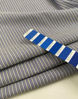 Pure virgin wool fabric with striped pattern, light blue in color. High quality deadstock fabric.