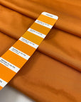 Pure viscose in apricot orange very soft, light, and flowy. High-quality deadstock fabric by the meter collected in Stock from a Maison de Couture in Italy.