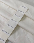 Stretch cotton piquet with texture in white color reference Sugar Swizzle. Very soft with low stretch. Ideal for trousers, dresses, skirts and jackets. High-quality deadstock collected in Stock from a Maison de Couture in Italy.