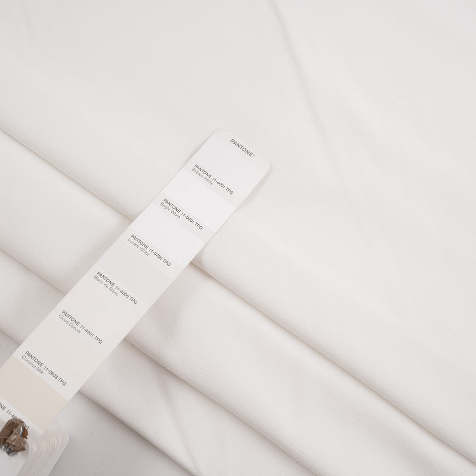 White and stretch technical polyester. High-quality deadstock fabric collected in Stock from a Maison de Couture in Italy.