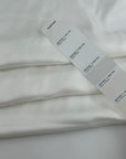 White pure silk twill, soft, fluid and non-stretch. Perfect for dresses and blouses. High-quality deadstock collected in Stock from a Maison de Couture in Italy.