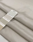 Pure silk crepe de chine with an ivory ground and gray stripes. Very soft and flowy, not transparent. Ideal for dresses, blouses, skirts, and shirting. High-quality deadstock collected in Stock from a Maison de Couture in Italy.