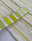 Linen and viscose with white ground and bright Charlock yellow stripes. Very soft and flowy. Ideal for dresses, blouses, skirts, and shirts. High-quality deadstock fabric by the meter collected in Stock from a Maison de Couture in Italy