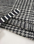 Prince of Wales, stretched wool boiled jersey. Geometric pattern and structured. High quality deadstock fabric.