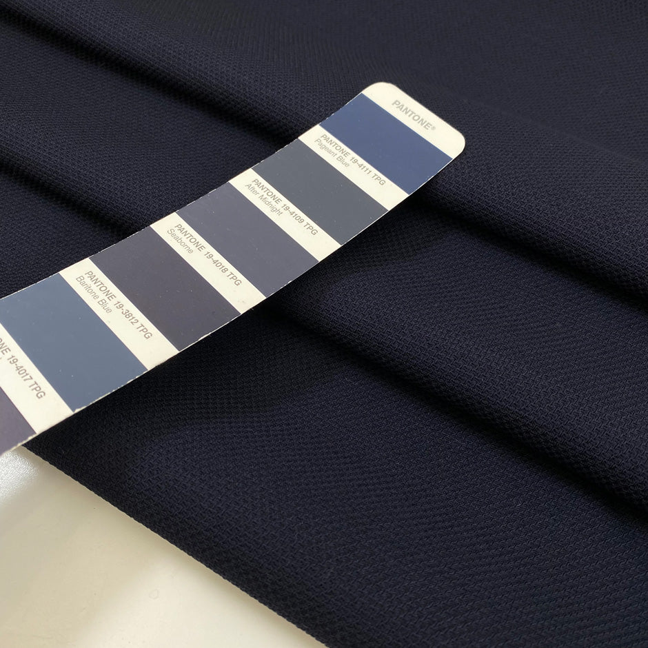 Wool and cotton blend in dark blue with a textured surface. Very soft and light, not transparent. Ideal for dresses, skirts, jackets, and light trousers. High-quality deadstock collected in Stock from a Maison de Couture in Italy.