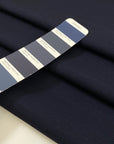 Wool and cotton blend in dark blue with a textured surface. Very soft and light, not transparent. Ideal for dresses, skirts, jackets, and light trousers. High-quality deadstock collected in Stock from a Maison de Couture in Italy.