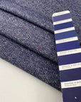 Mixed wool tweed in the shade of blue. High quality deadstock fabric.