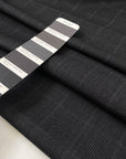Pure wool in dark gray with classic Prince of Wales check. Elegant and versatile, ideal for suits, coats, and skirts. High-quality deadstock collected in Stock from a Maison de Couture in Italy.
