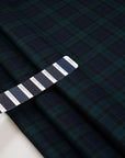 Dark and falling pure watch wool tartan. High-quality deadstock fabric collected in Stock from a Maison de Couture in Italy.