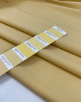 Cotton polyester fabric in pale banana yellow, very crunchy, light, and not transparent, ideal for shirts, dresses, and structured pieces. High-quality deadstock collected in Stock from a Maison de Couture in Italy.