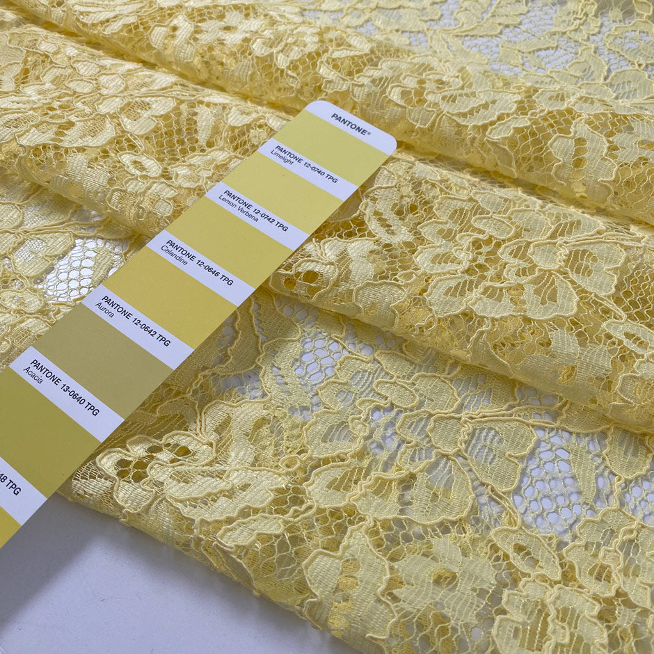 Polyester lace in limelight yellow with double scallop. Light and decorative, ideal for dresses, blouses, and skirts. High-quality deadstock collected in Stock from a Maison de Couture in Italy.